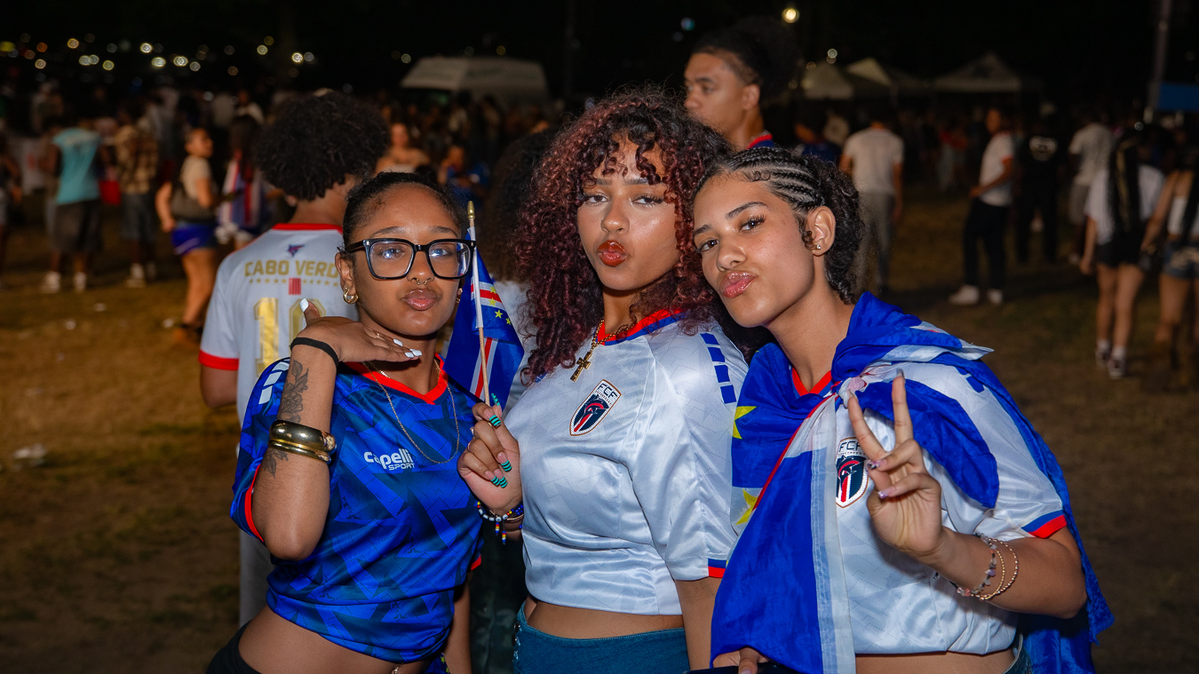 Three young women celebrating with Cape Verde colors