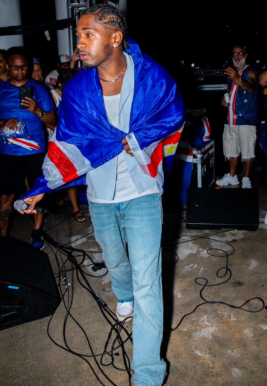 Cape Verdean performer wrapped in the Cape Verde flag